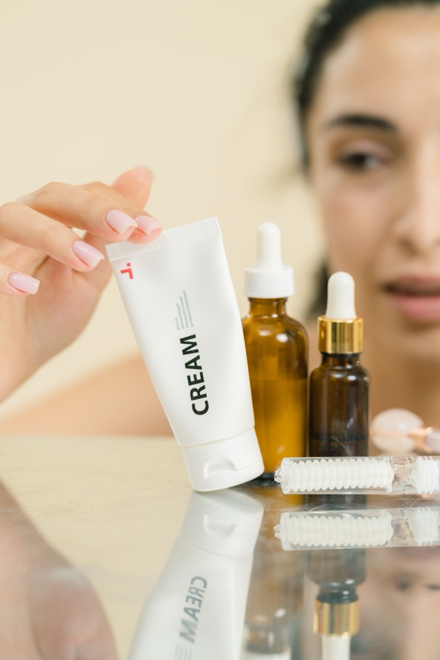 Hand cream, serum dropper bottles and a face roller